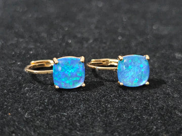 18K gold-plated earrings featuring luminous blue opal stones, lightweight, hypoallergenic, and perfect for everyday wear or gifting