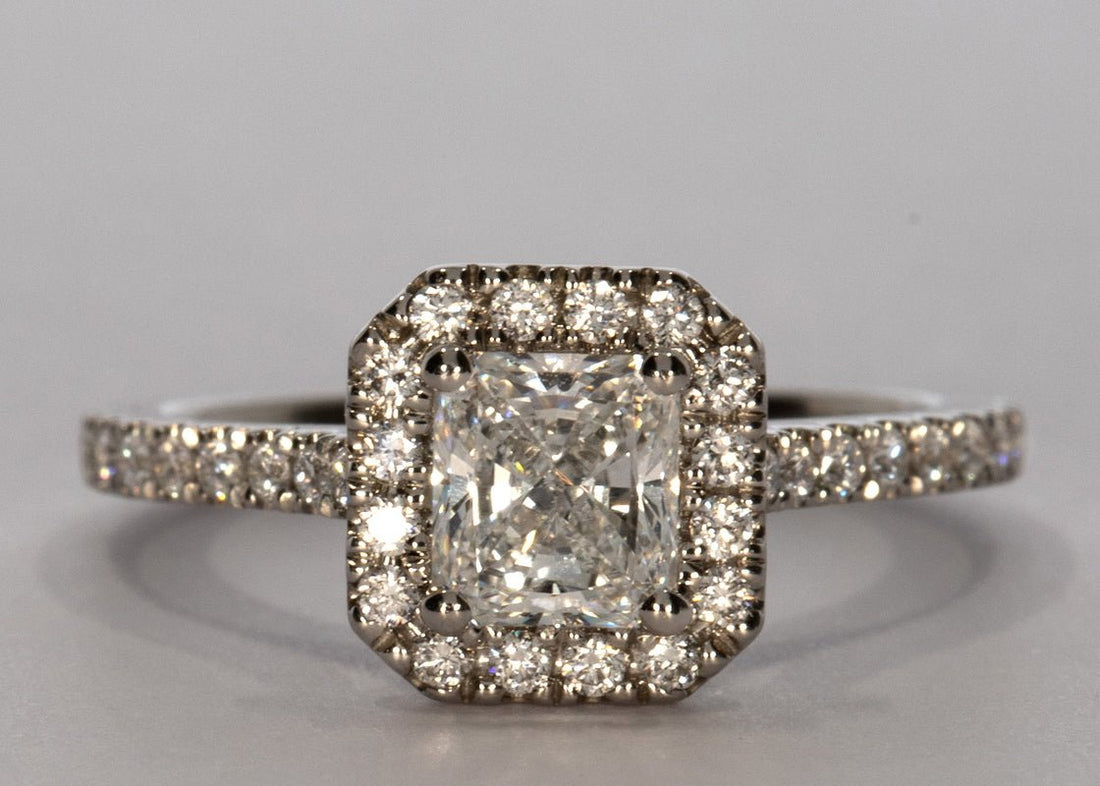 Aphrodite ring in Platinum set with a Radiant 0.77ct E - Extremely White VVS1 - Natural Diamond. Set with Round cut sparkling diamonds for a total weight of 0.35ct. This delicate micro set ring has a 1.6mm wide band. - Prestige Stones