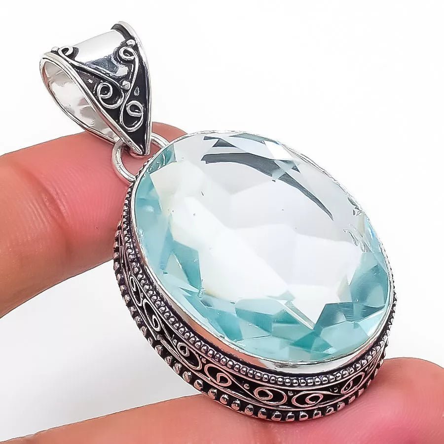 Handcrafted 925 sterling silver pendant featuring a faceted aqua apatite gemstone with ethnic-inspired design