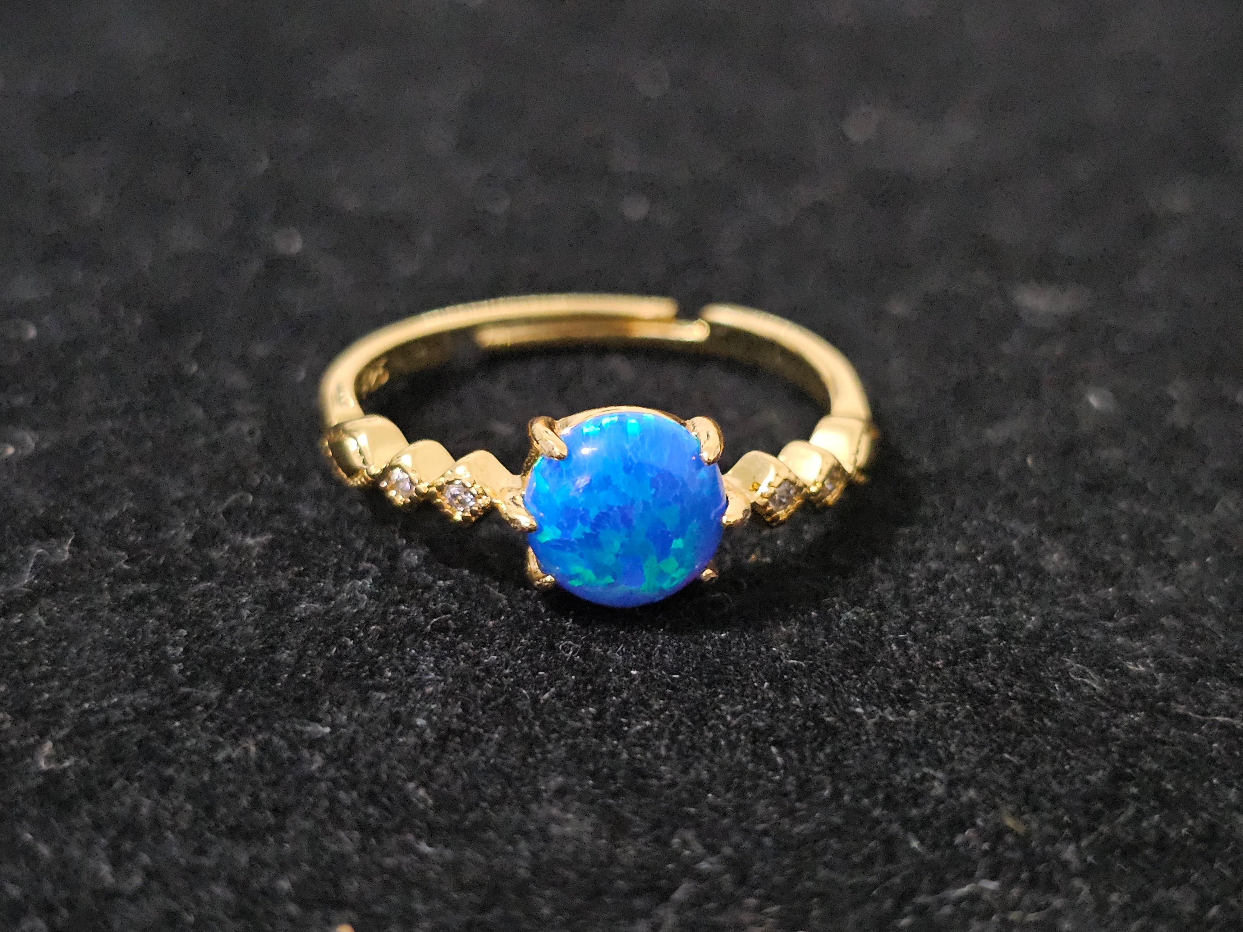 Blue opal ring with sparkling zircon accents, 18K gold-plated finish, adjustable size 53–60mm, lightweight and hypoallergenic