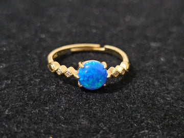 Blue opal ring with sparkling zircon accents, 18K gold-plated finish, adjustable size 53–60mm, lightweight and hypoallergenic