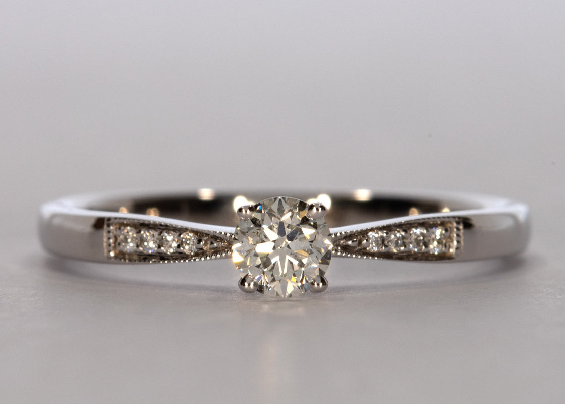 Delicacy Vintage ring in White Gold set with a Round 0.30ct. H - White SI1 - Slightly Included Natural Diamond.