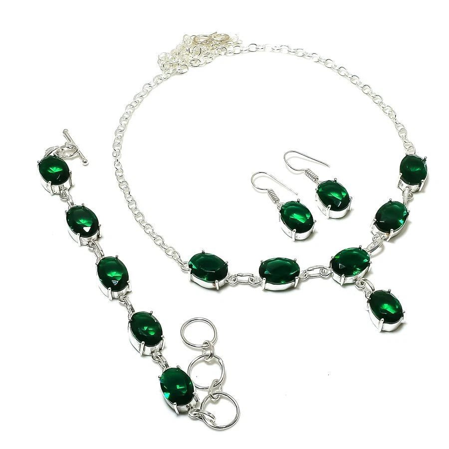 Handmade silver-plated jewelry set with oval-cut lab-created chrome diopside stones including pendant, bracelet, and earrings