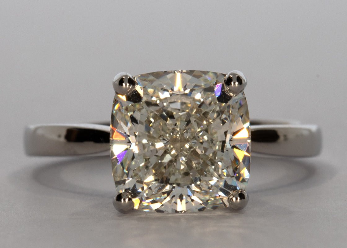 Delicacy ring in Platinum set with a Cushion 4.01ct H - White VS1 - Lab - grown Diamond. This delicate design showcases the diamond with grace and subtlety with a band width of 2mm which tapers toward the diamond to enhance size and brilliance. - Prestige Stones