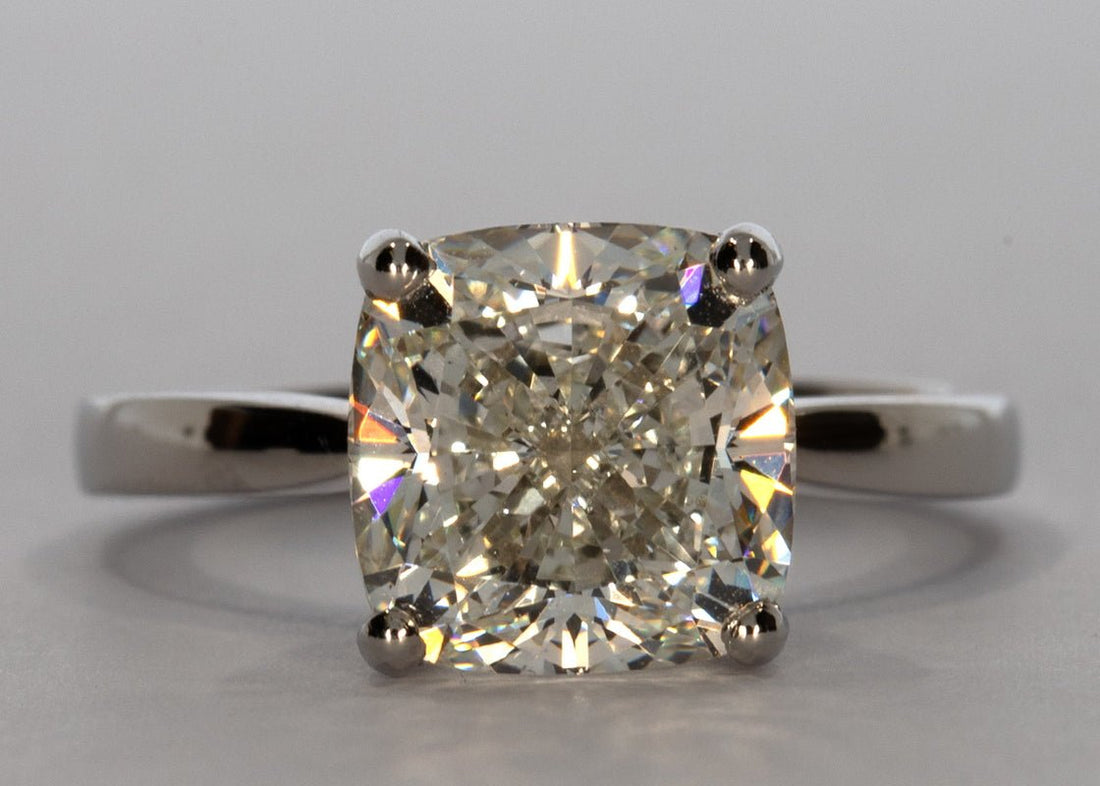 Delicacy ring in Platinum set with a Cushion 4.01ct H - White VS1 - Lab - grown Diamond. This delicate design showcases the diamond with grace and subtlety with a band width of 2mm which tapers toward the diamond to enhance size and brilliance. - Prestige Stones