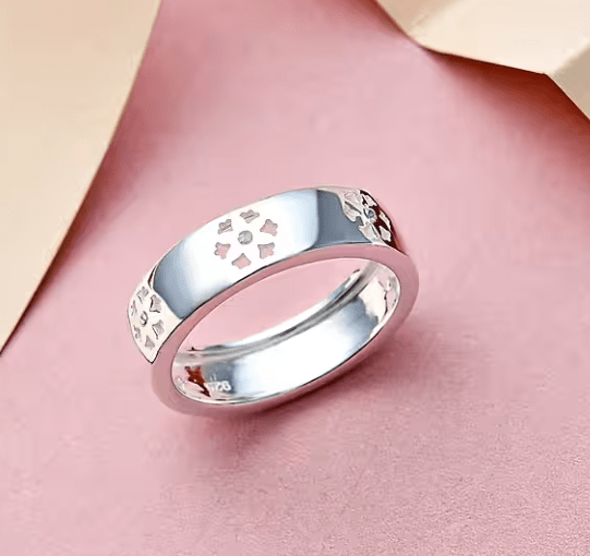 diamond floral band ring in sterling silver with 3 single-cut diamonds and cut-out floral motifs