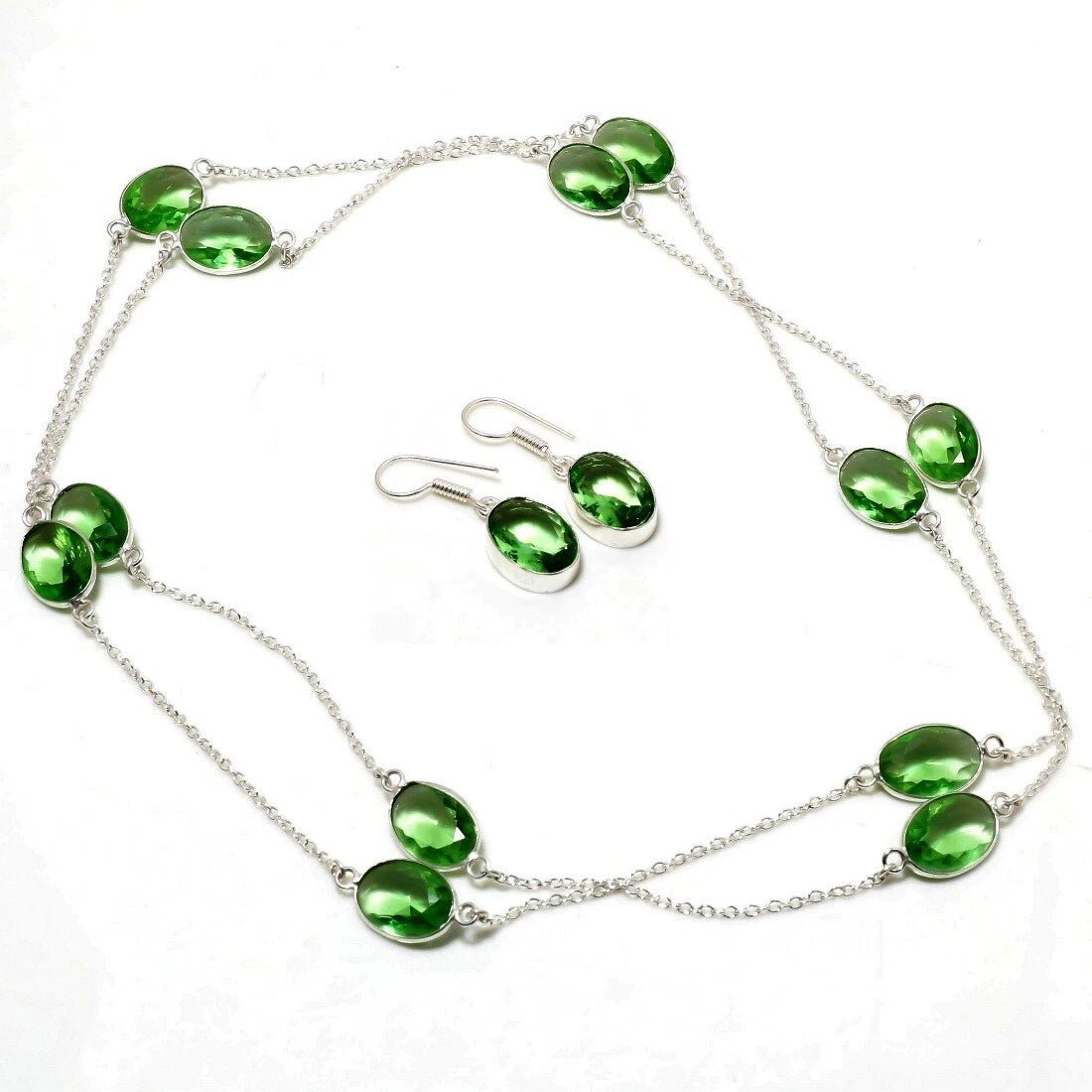 Handmade silver-plated jewelry set with oval-cut lab-created green amethyst stones, featuring a 36-inch necklace and matching drop earrings