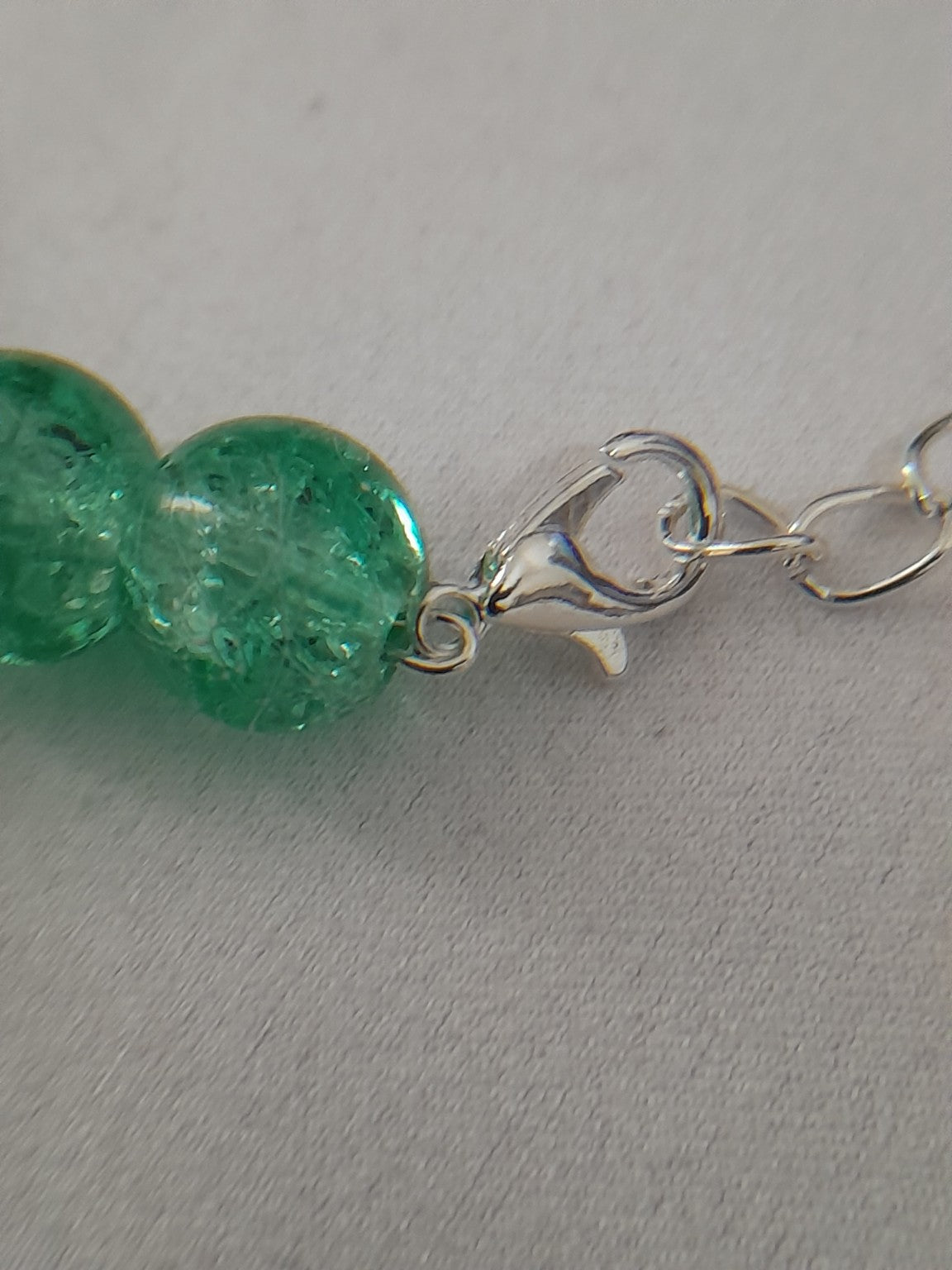 Green Crackle Glass & Red Bead Charm Bracelet - Prestige Stones