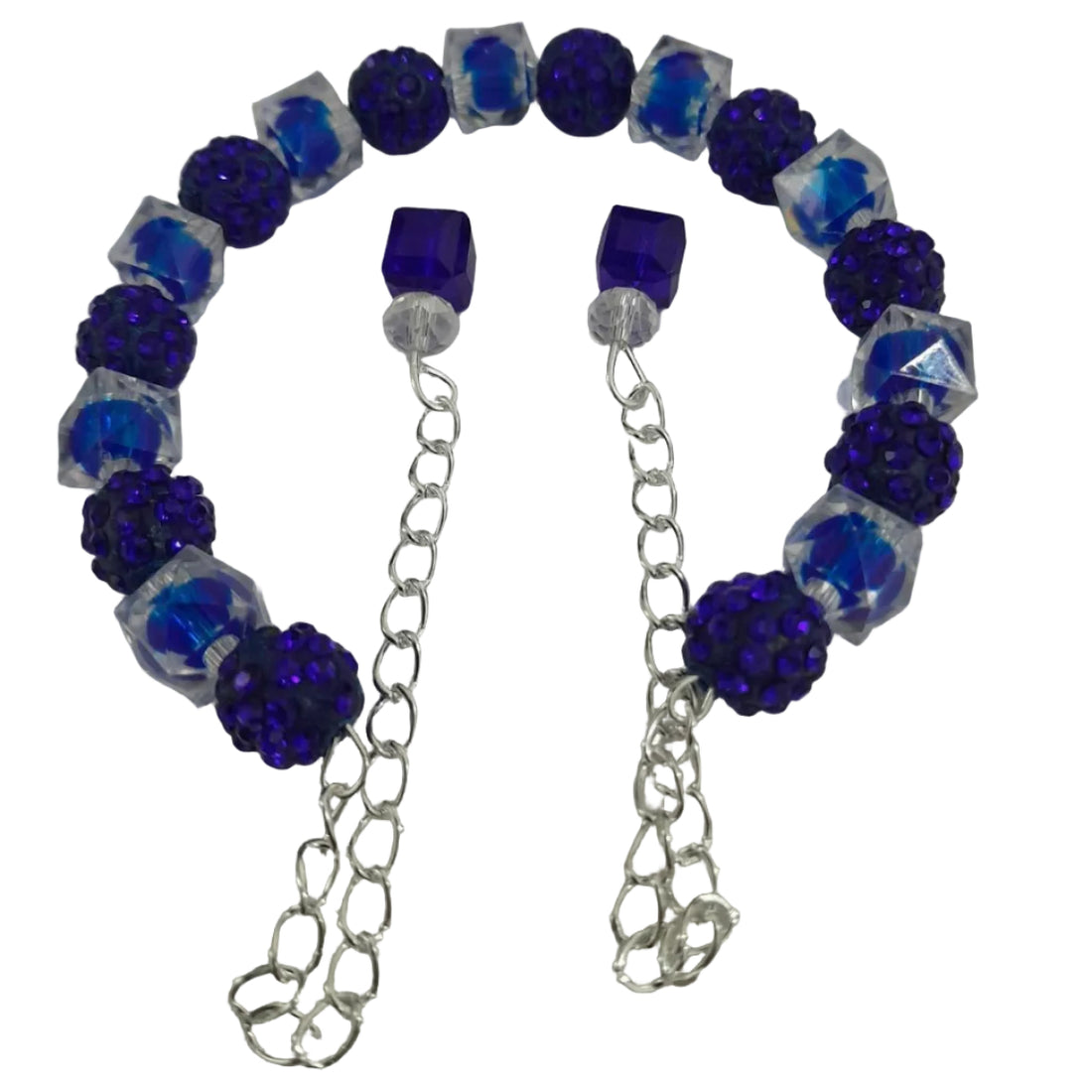 Open-ended bracelet with deep blue pavé crystal beads, clear faceted acrylic beads, and dual chain dangles with blue cube accents