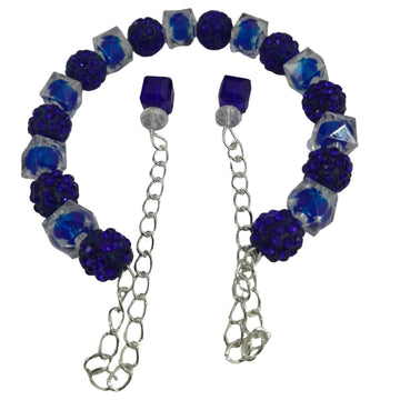 Open-ended bracelet with deep blue pavé crystal beads, clear faceted acrylic beads, and dual chain dangles with blue cube accents