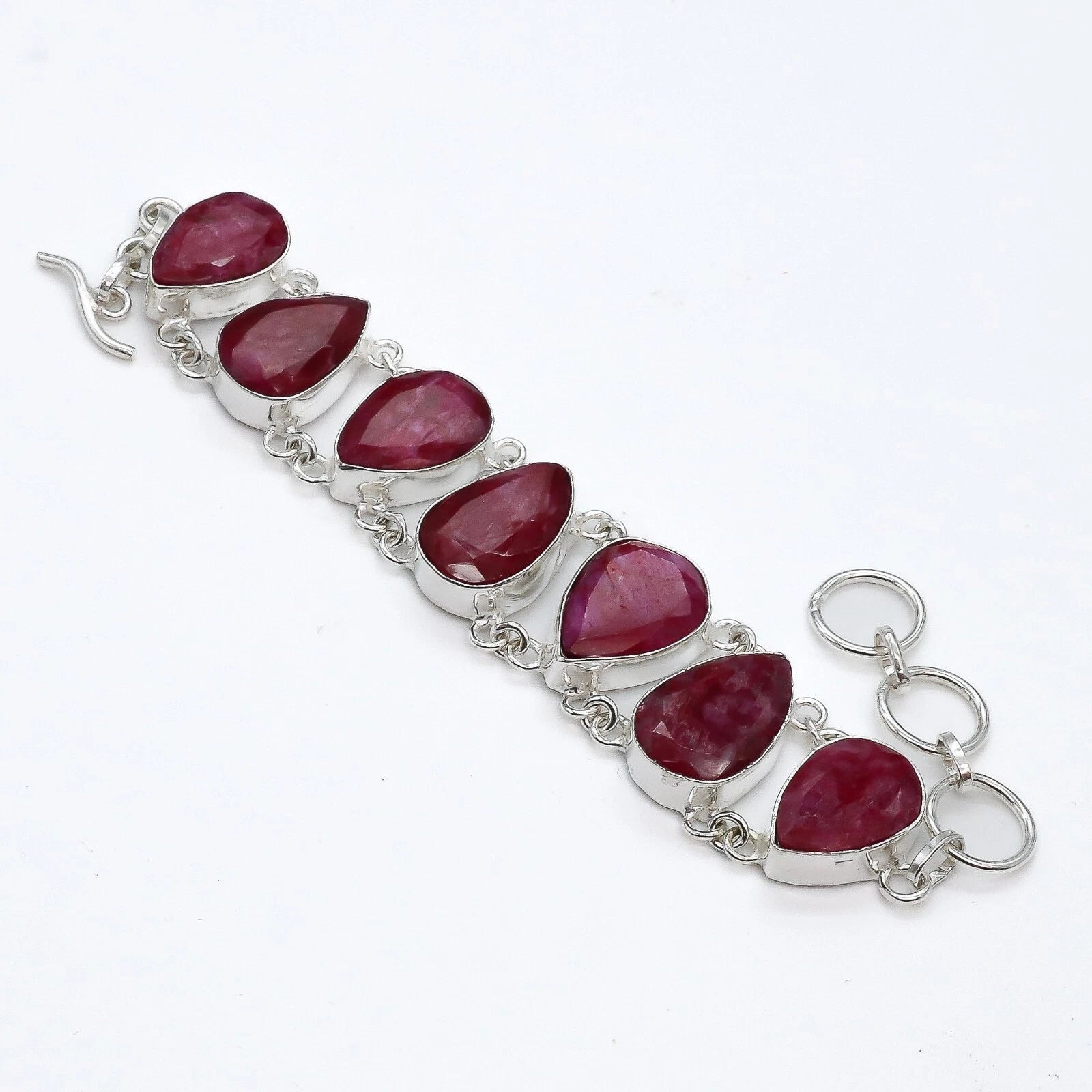 Lab-created ruby statement bracelet in handcrafted 925 sterling silver – 7 pear-cut rubies with adjustable hook clasp