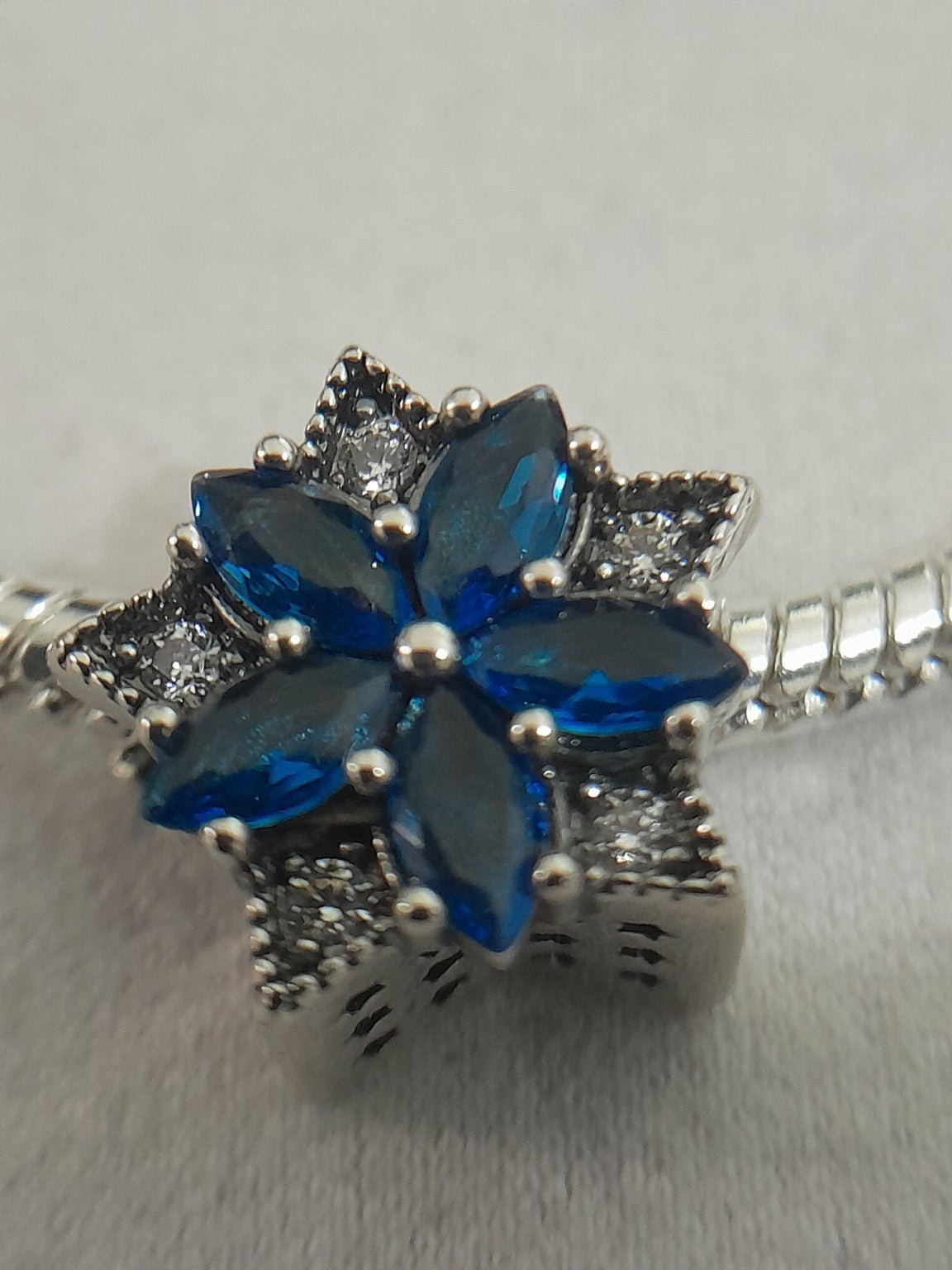 Silver - Plated Snake Chain Bracelet with Blue Crystal Flower Charm - Prestige Stones