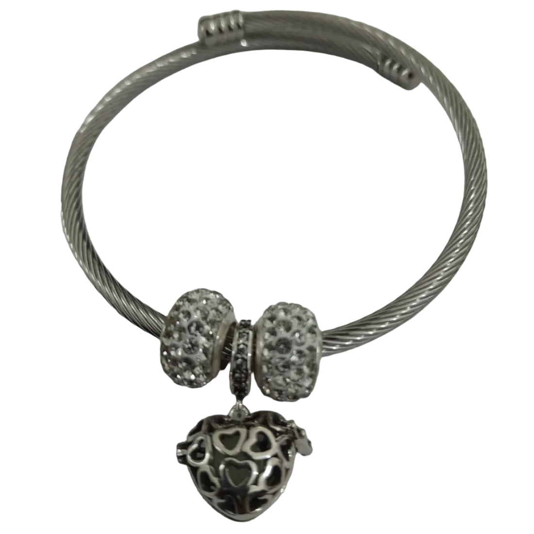 Silver-plated twisted-wire cable bangle with pavé crystal beads and filigree heart charm, flexible open-ended design for everyday wear