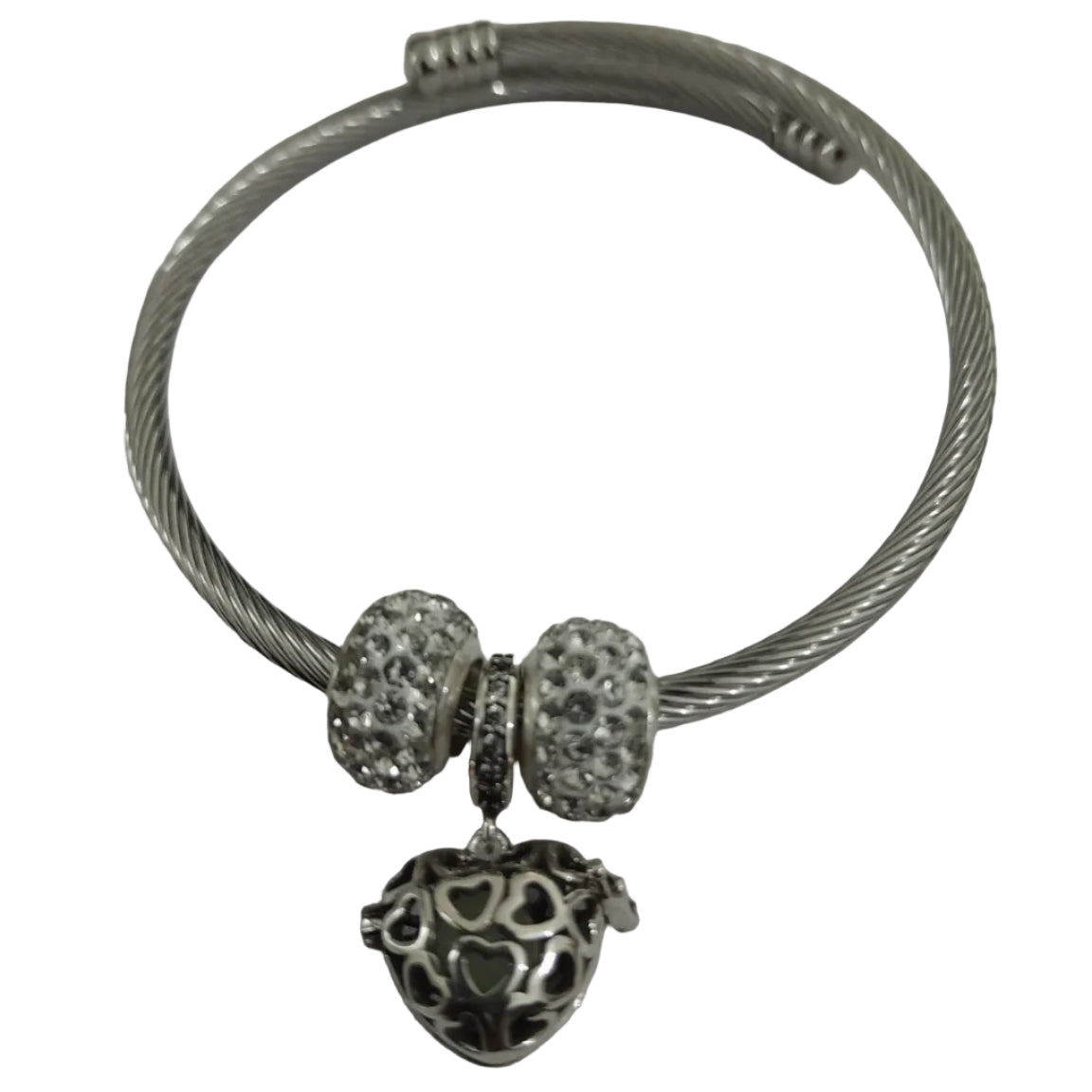 Silver-plated twisted-wire cable bangle with pavé crystal beads and filigree heart charm, flexible open-ended design for everyday wear