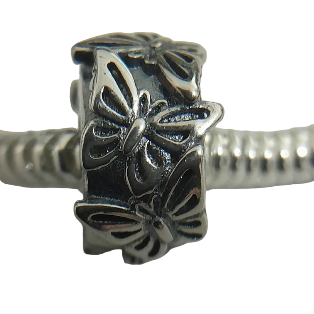 Premium sterling silver butterfly charm bracelet with smooth snake chain, raised wings, and oxidised detailing