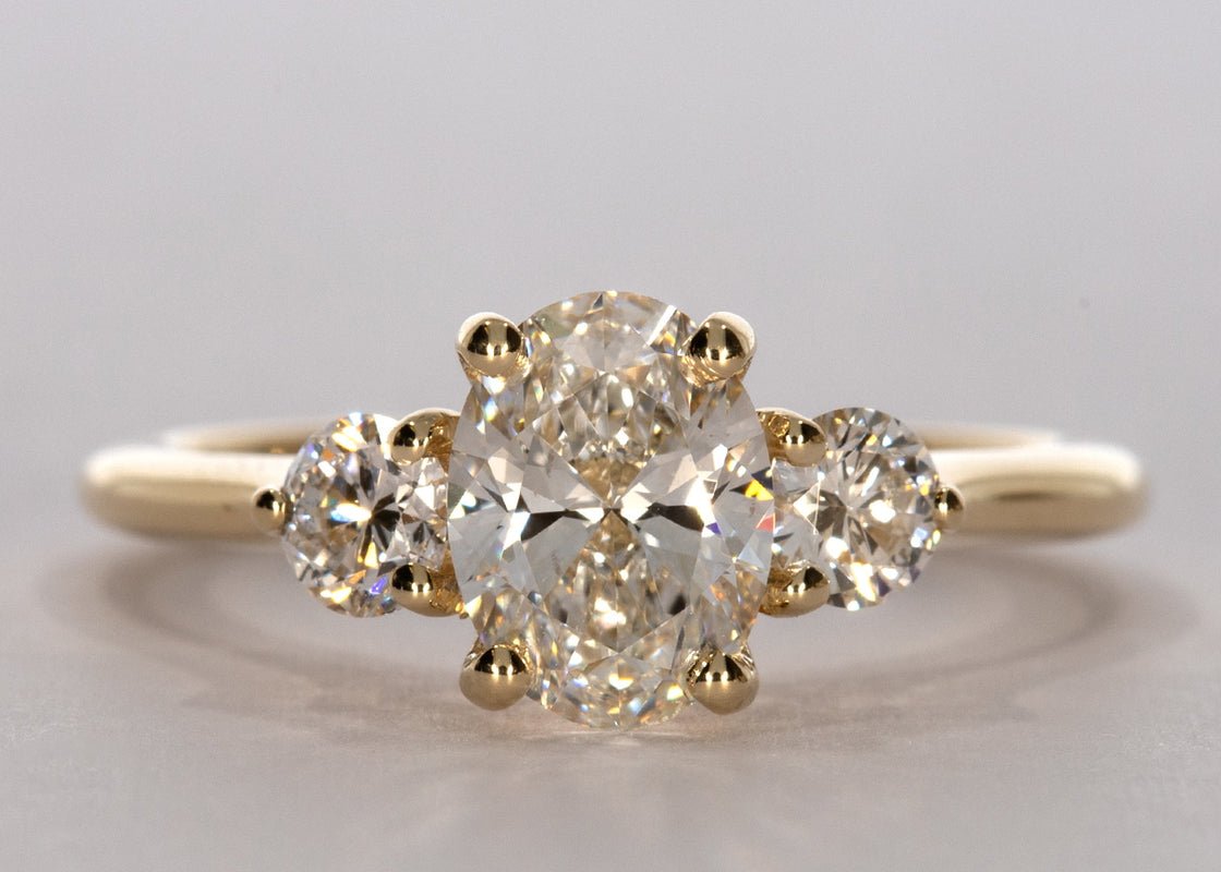 Valencia ring in Yellow Gold set with a Oval 1.06ct. D - Perfectly White VVS1 - Diamond. With a total carat weight of 0.30ct and a 1.8mm rounded D - shape band. - Prestige Stones